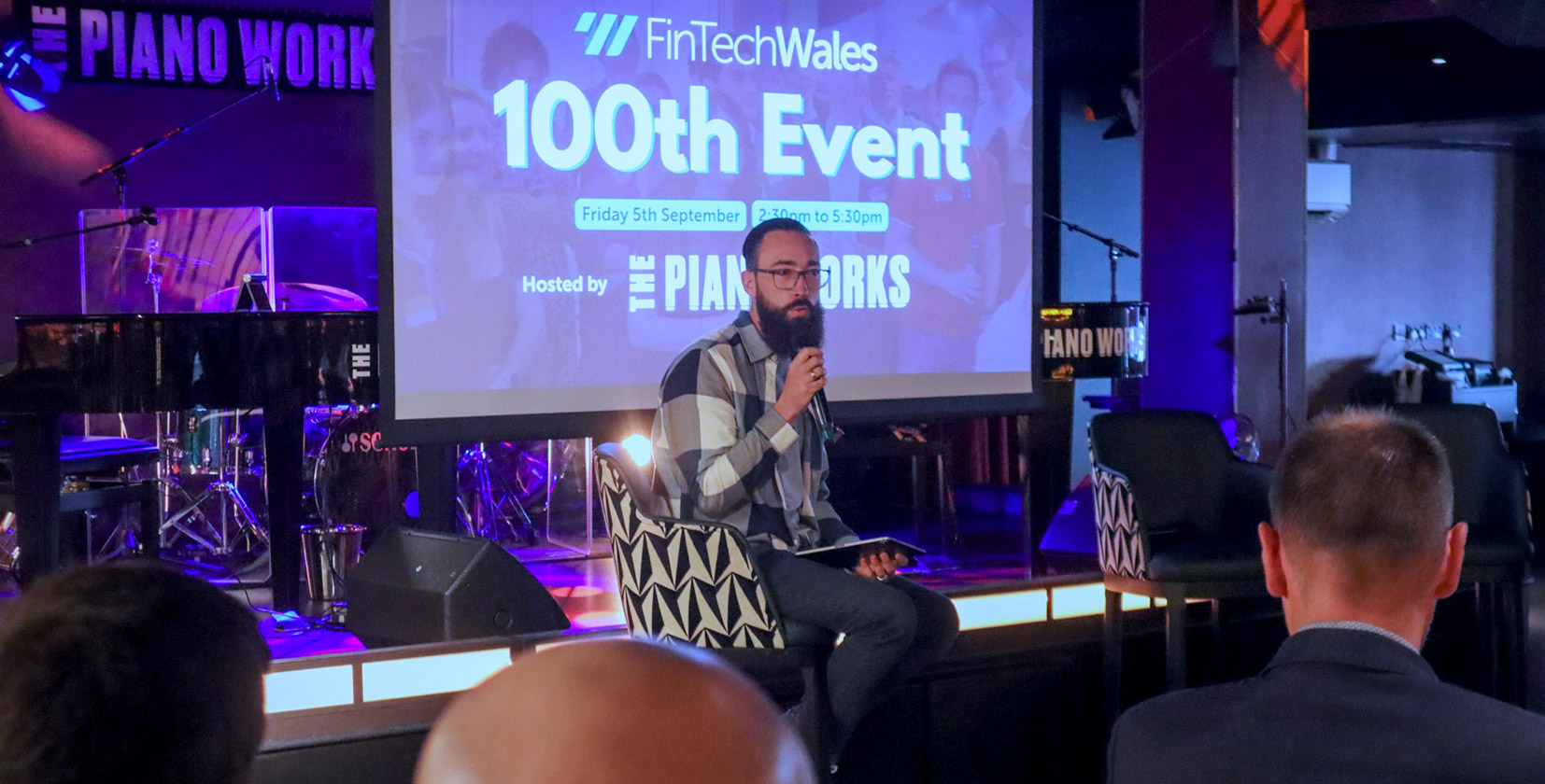 An image of Scott Jones, CEO of Illustrate Digital, hosting the 100th event in Cardiff for FinTech Wales